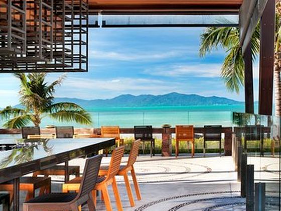 Table at a beachfront restaurant looking out to the sea on Koh Samui