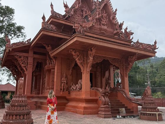 Red Thai temple with carved wooden roof on Koh Samui