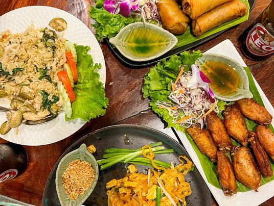 Thai dishes spread across a table on Koh Samui